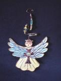 Christmas Guardian Angel Ornament- This porcelain handmade ornament is painted in translucent and gold enamel details. AB Austrian Flower Finding, Amethyst Austrian Crystals, glass  beads and wire are used for final and hanging details.