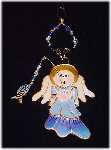  This porcelain handmade ornament is painted in translucent colors, antique gold paint and gold enamel details. AB Austrian Crystals, glass  beads and wire are used for final and hanging details. Oops! I got Jesus in the fish!