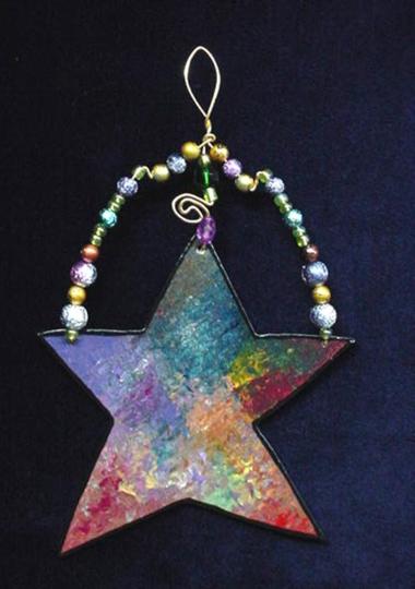 This porcelain handmade ornament is painted in bright colors and black enamel details. Glass  beads and gold color wire are used for final and hanging details. Very different!