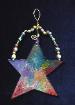 Christmas 'Artistic Star' Ornament- This porcelain handmade ornament is painted in bright colors and black enamel details. Glass  beads and gold color wire are used for final and hanging details. Very different!
