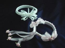 Handmade with satin ribbon, pearls and beads. Ribbon handmade roses are also applied for final details. Beautiful and unique designs to match any baby set.