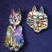 Cat Pins Set (2)-  These porcelain handmade pins are hand-painted in bright colors and black enamel details. Accented Austrian crystals for the eyes. Very different! Great for the cat lovers