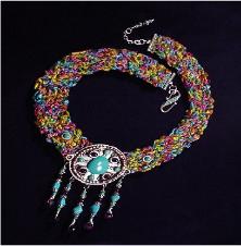 Fiber Crochet Turquoise Necklace - A special order from Cleopatra, and also Nefertiti wants it too!Handcrafted crochet with fibers. Metal Silver medallion. Chinese, Kingman, Sleeping Beauty Turquoise and A Grade Amethyst. Sterling Silver findings and clasp. Limited production.