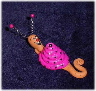 Handmade with glazed Fimo. Nickel and silver wire are used for final details. Pins are embellished with Austrian crystals.