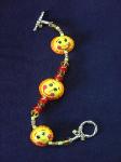 Fimo Jewelry Happy Sun Bracelet- Handmade with glazed Fimo. Glass beads and silver plated  findings and clasps are used for final details. You can match it with a bookmark gift!!! Perfect for a special gift!