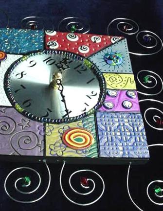 Textured Fimo and Wire Wall Clock - Handmade with  Fimo and Polymer Clay. Nickel  wire, glass beads and wood are used for final details. Quartz clock quality is used for the clock system. This clock will enhance any area in your home or office. One-of-a-kind. Unique Design!