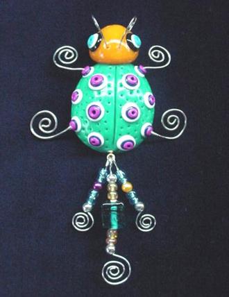 Handmade with glazed Fimo. Silver plated  wire and glass beads are used for final details.