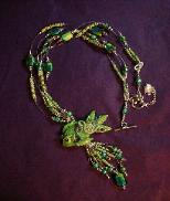 Dichroic Glass and Polymer Clay Green Fish Pendant Necklace -  Handcrafted with Lime Green and Turquoise Blue Dichroic medium round and square large Glass beads. Czech Lime Green and Aquamarine Glass Seed Beads are used to embellish the necklace.  Silver plated  beads, fish charm, crimp tubes, final chain, clasp and findings are used for final details. Swarovski Crystals are used to accent the Polymer Clay Green Fish Pendant. Beadalon 19 flexible .018 in stringing wire is used to complete and embellish this unique creation. Beautiful and Elegant!