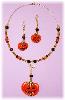Pumpkin Necklace and Earring Set- This porcelain handmade jewelry set is painted in glossy Halloween colors. Glass beads and gold plated findings are used for final details. Both items can be sold separately. Unique Design!