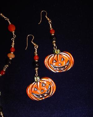 Pumpkin Earrings Set-This porcelain handmade earrings set is painted in glossy Halloween colors. Glass beads and gold plated findings are used for final details. Unique Design!