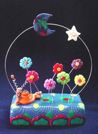 Handmade with glazed Fimo. Nickel and silver wire are used for final details. Austrian crystals are used for final details. 