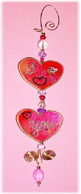 This porcelain handmade ornament is painted in bright colors and gold enamel details. AB Austrian Crystals are used for the 