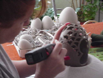 Mary creating, carving and designing an Eggypiece.