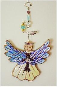 Guardian Angel Detail Image This porcelain handmade ornament is painted in translucent and gold enamel details. AB Austrian Flower Finding, Amethyst Austrian Crystals, glass  beads and wire are used for final and hanging details. 